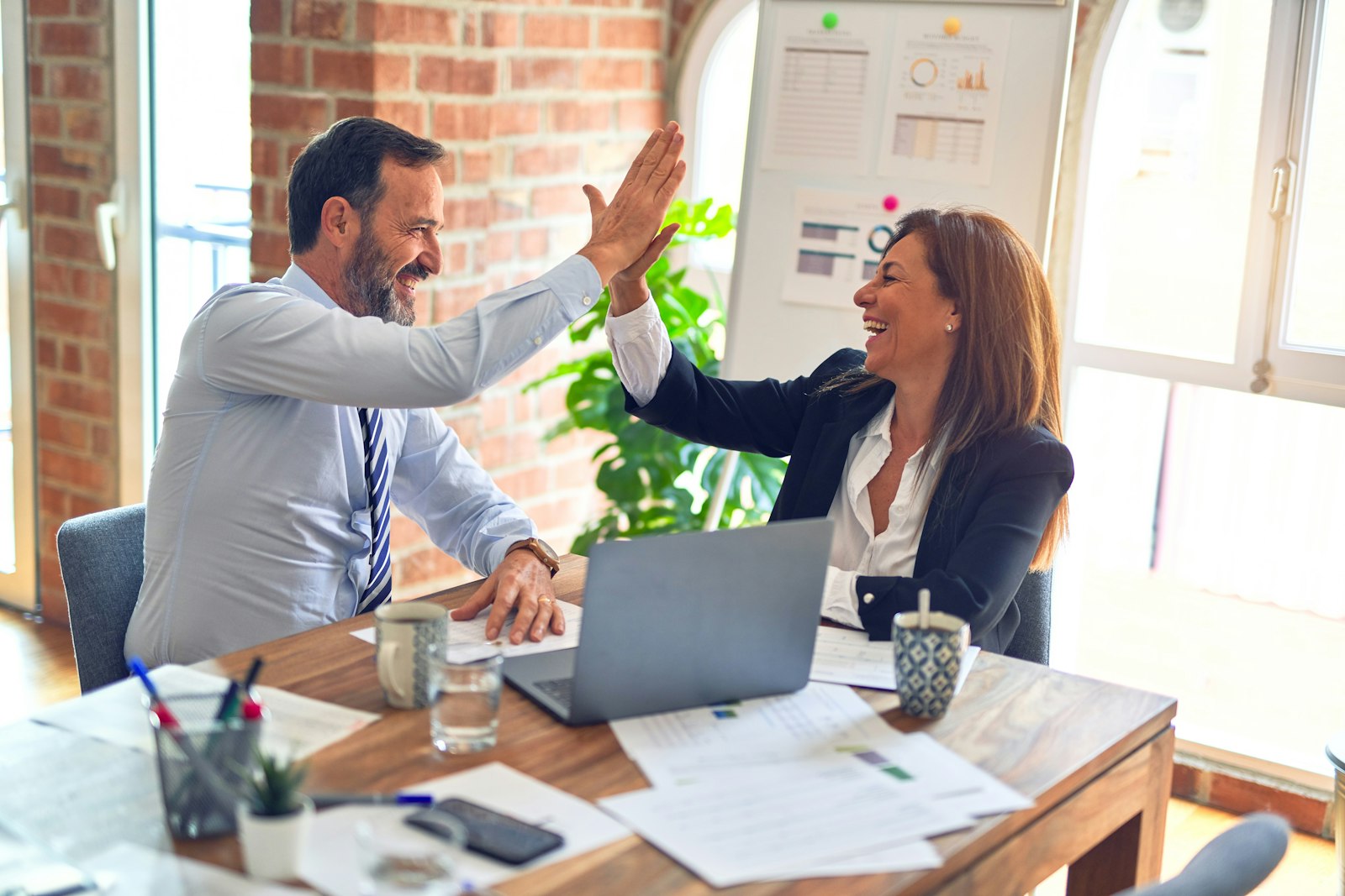 Business partners celebrating a closed deal